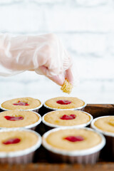 freshly baked cupcakes with strawberry berry filling on a wooden tray.Food for breakfast. Freshly baked cupcakes for dessert. Foodies and cuisine.