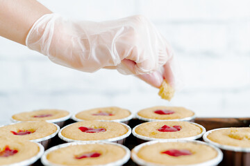 freshly baked cupcakes with strawberry berry filling on a wooden tray.Food for breakfast. Freshly baked cupcakes for dessert. Foodies and cuisine.