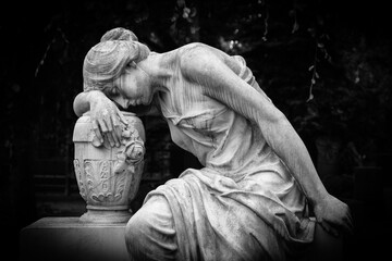 Sad and weeping woman sculpture. Sad grieving expression sculpture with sorrow face down thinking...