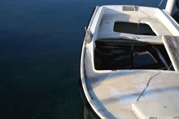 Fototapeta na wymiar Old rustic boat in a port. Selective focus.