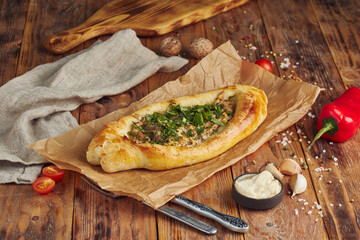 Adjarian Khachapuri with meat – Georgian pie. Baked open pie with cheese and meat