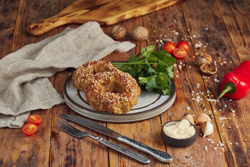 Fried minced meat (meat cutlet) on a plate, wooden background