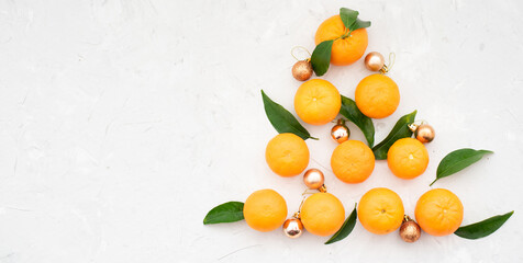Christmas tree made of tangerines, the mood and taste of the new year, decorated with christmas...