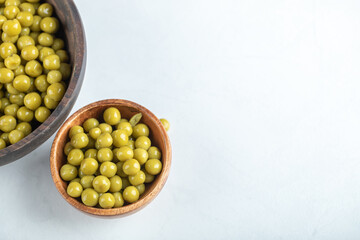 Two bowl full with marinated green olives