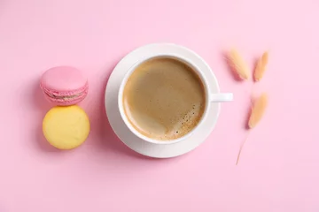 Poster Aromatic morning coffee and macarons on pink background, flat lay © New Africa