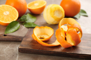 Naklejka na ściany i meble Orange fruit peel on grey marble table