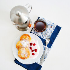 Pancakes with cottage cheese, cranberries and yogurt for breakfast