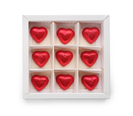 Heart shaped chocolate candies in box on white background, top view