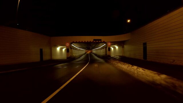 Netherlands - 10 februari 2021, Hilversum: Night-time curfew during corona time POV driving through empty streets