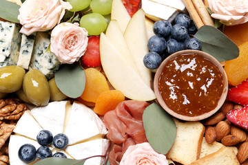 Tasty assorted appetizers as background, top view