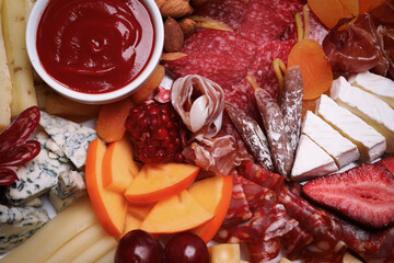 Different appetizers with dip sauce as background, top view