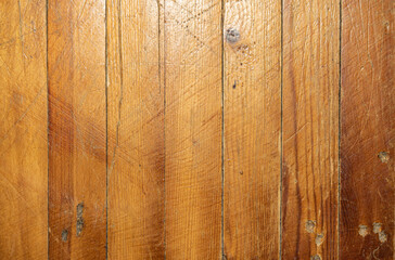 Old varnished boards with traces of use. Vertical parquet boards
