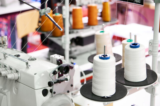 Spools of thread and sewing machines
