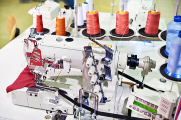 Spools of thread and sewing coverstitch machine