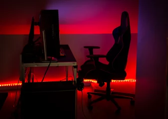 Fotobehang Gaming Modern LED red ambient light around gaming computer set at home. Home decor concept.  © FotoHelin