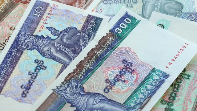Myanmar money, Kyat. Different types of banknotes rotating slowly on their own axis. Economic and business concept 