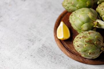 artichokes on grey background. fresh organic artichoke flower