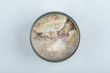 Top view of open can, canned beef on white background