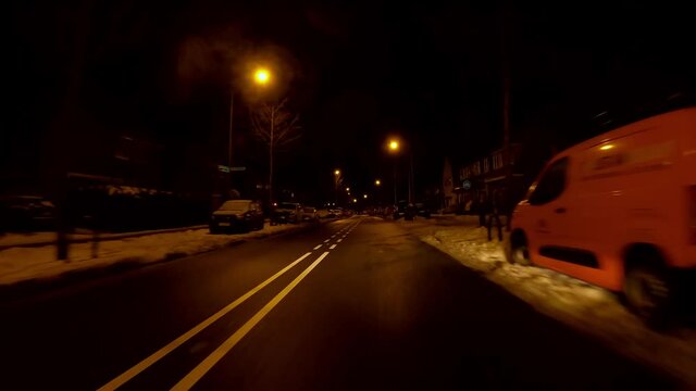 Netherlands - 10 februari 2021, Hilversum: Night-time curfew during corona time POV driving through empty streets
