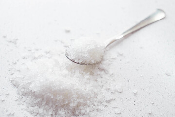 sea salt on the marble table and in spoon.