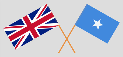 Fototapeta na wymiar Crossed flags of the UK and Somalia. Official colors. Correct proportion