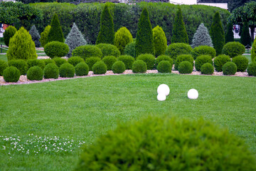 backyard 3 lights garden with electric ground lanterns with sphere diffuser lamps in lawn in...