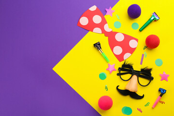Flat lay composition with clown's accessories on color background. Space for text