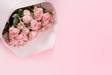Beautiful pink roses bouquet on pink background