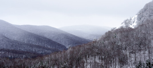 Fototapeta na wymiar Snowy mountains landscape in the horizon