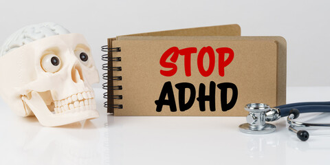 On the table lies a skull, a stethoscope and a notebook with the inscription - STOP ADHD