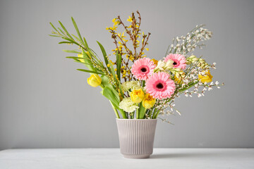 Finished flower arrangement in kenzan a vase for home. Flowers bunch, set for interior. Fresh cut flowers for decoration home. European floral shop. Delivery fresh cut flower.