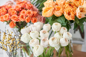 Set of white, green and orange flowers for Interior decorations. The work of the florist at a flower shop. Fresh cut flower.