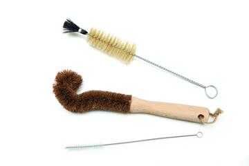 The cleaning brushes for bottles, one is made from wood and natural bristles, two are made of...