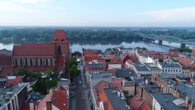 A panorama of Toruń with old tenement houses and a view of the bridge over the Vistula. Drone video.