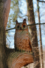 wooden wood installation in the forest wooden owl