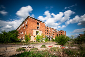 Fototapeta na wymiar Abandoned brick building at blue sky