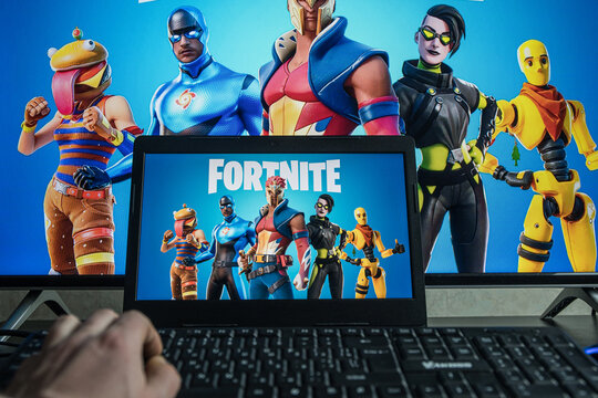 PC gaming. Playing Fortnite video game on computer
