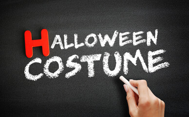 Halloween costume text on blackboard, concept background