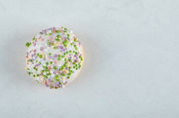 Fototapeta na wymiar White cookie with candies on white background