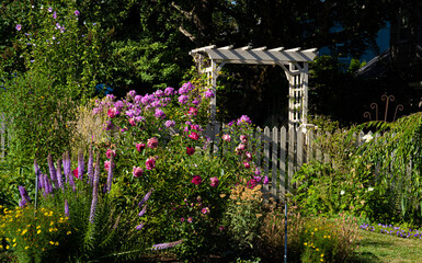 A garden gate in a flower garden in Salem, Oregon