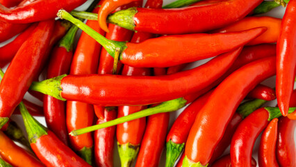Red hot chilli peppers on white background. Close up. A backdrop of Red hot chilli peppers.