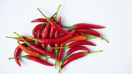 Red hot chilli peppers on white background. Close up. A backdrop of Red hot chilli peppers.