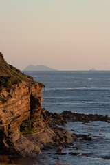 Fototapeta na wymiar Sunset on the ocean cliffs