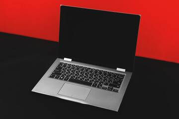Fototapeta na wymiar Workspace with mockup laptop, black blank screen on a flat lay background