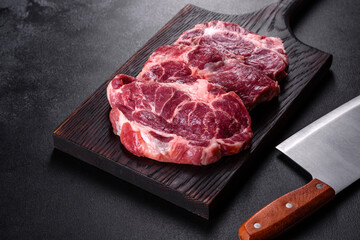 Fresh raw beef meat to make delicious juicy steak with spices and herbs