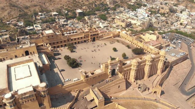 Top view over main entrance of Amber fort, ovelooking Suraj Pol (Sun Gate) and Chand Pol (Moon Gate) Jaipur, Rajasthan, India - Aerial Orbit wide shot