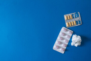 common cold background of pills and used tissue with copy space. High quality photo