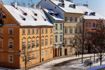 Panorama of Na Kampe Street and square on Kampa Island under Charles Bridge, Prague Venice under snow in sunny winter day, Mala Strana, Lesser Town district, Prague, Czech Republic