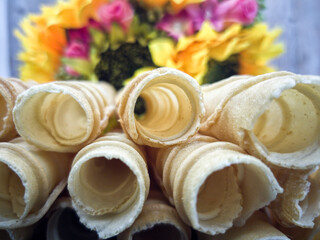 Love letters or locally known as kuih kapit or kuih sepit. Selective focus points. Blurred background
