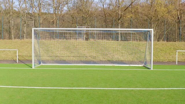a soccer goal filmed backwards at a low angle